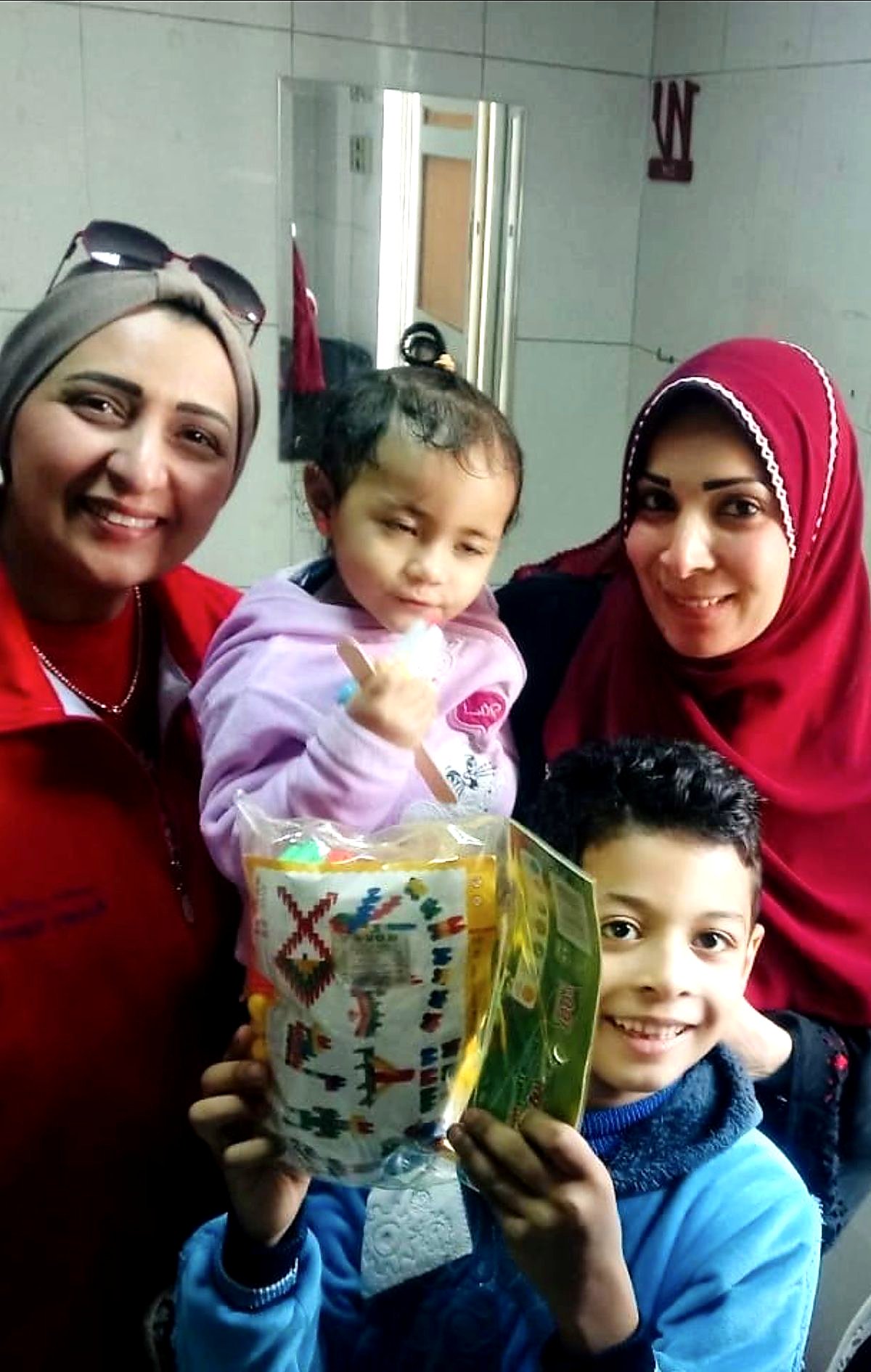 Children receiving gifts during a convoy