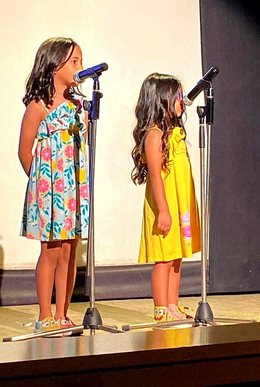 Children performing on stage at the Maadi Library annual cultural competition
