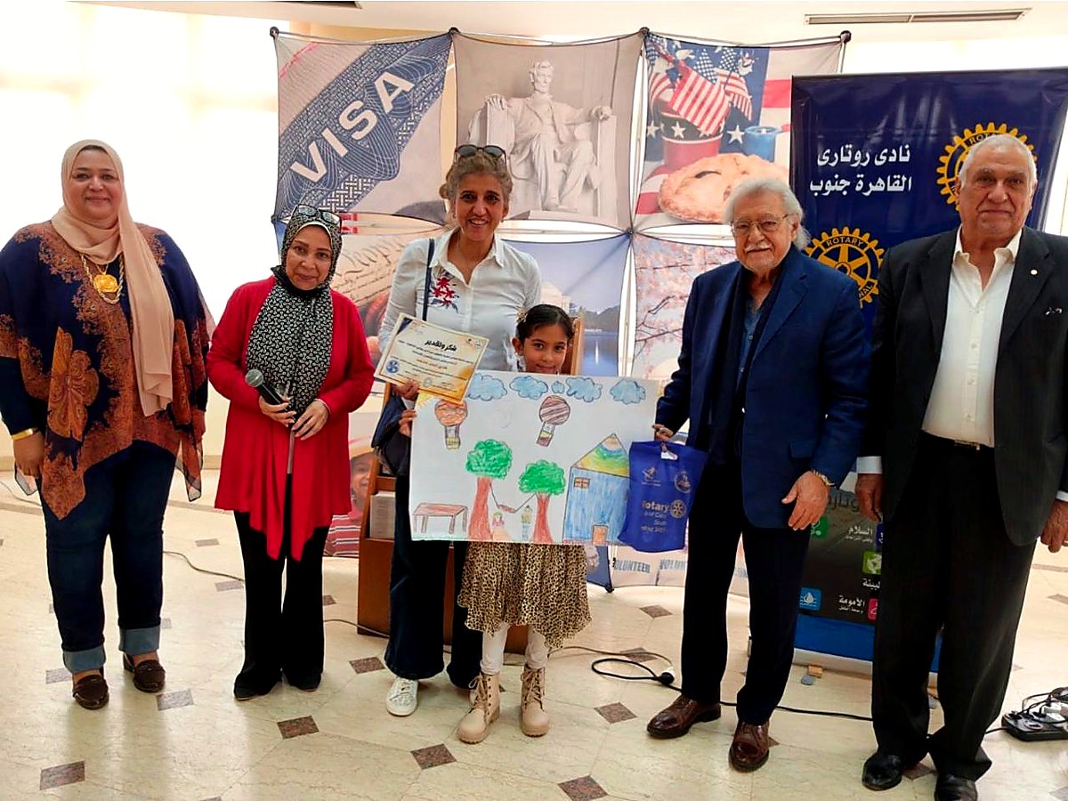 A young drawing-competition winner being honoured